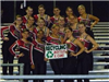 Dance team pose with Recycle Cans and Bottles sign